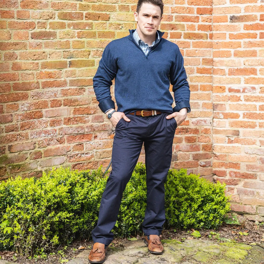 Man in navy blue sweater and dark trousers showcasing New Forest Classic Chinos