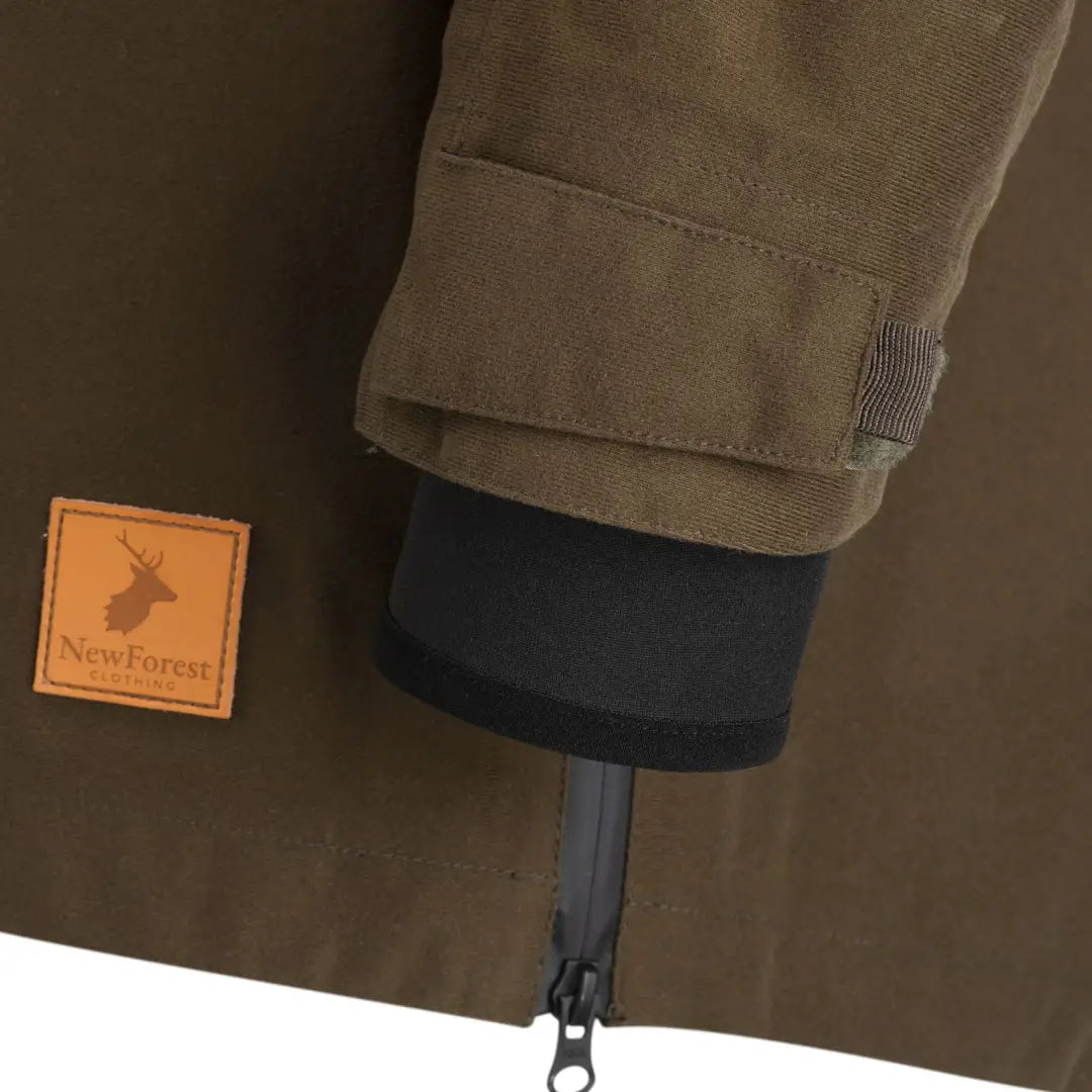 Khaki-colored Country Sport Smock with deer logo patch, perfect for forest adventures