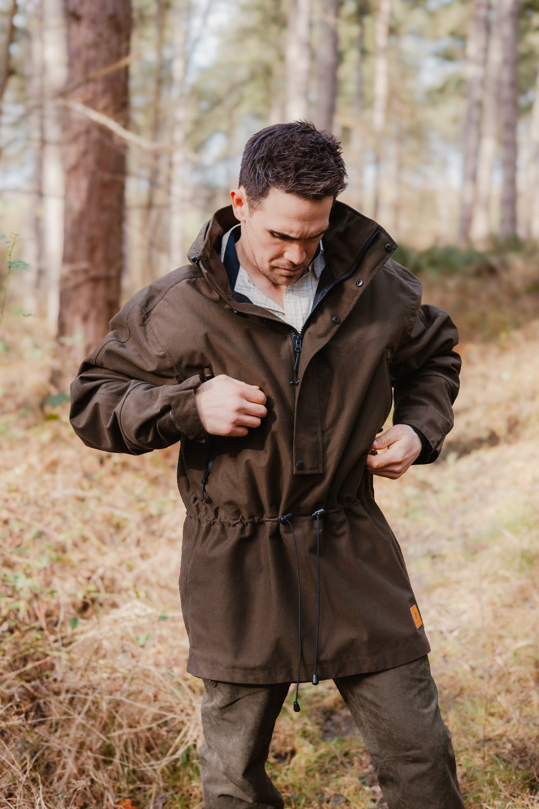 Man in brown hooded parka showcasing the stylish New Forest Country Sport Smock