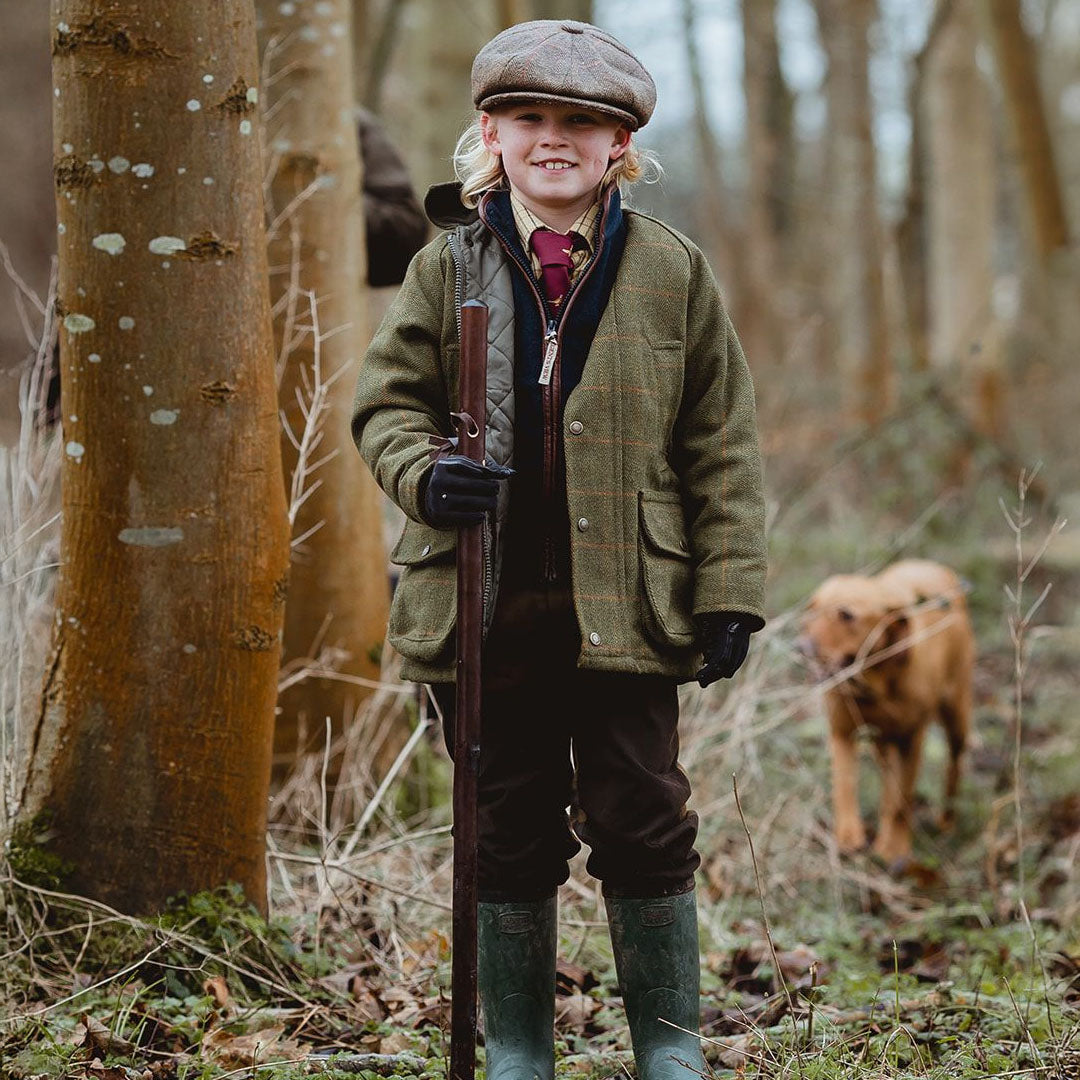 Young hunter in a kids tweed shooting jacket, ready for adventure in style