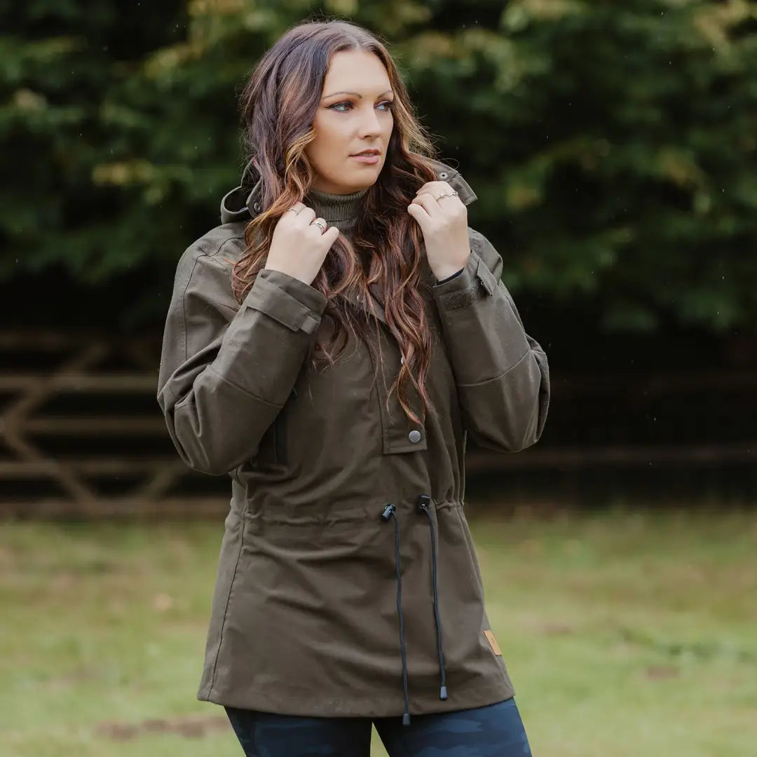 Olive green country sport smock with drawstring waist on a woman with long brown hair