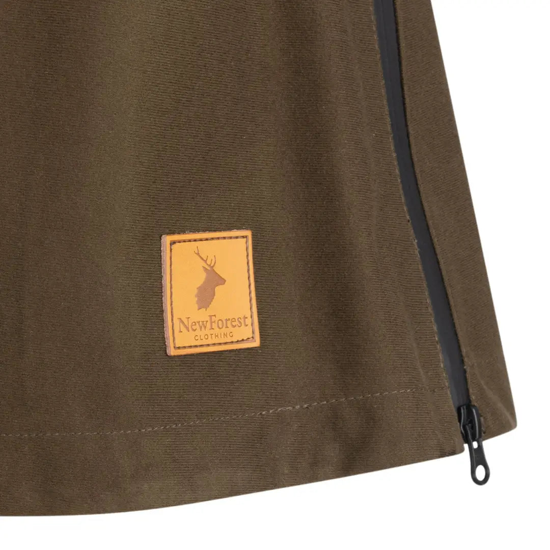 Leather patch with deer logo on New Forest country sport smock in brown fabric