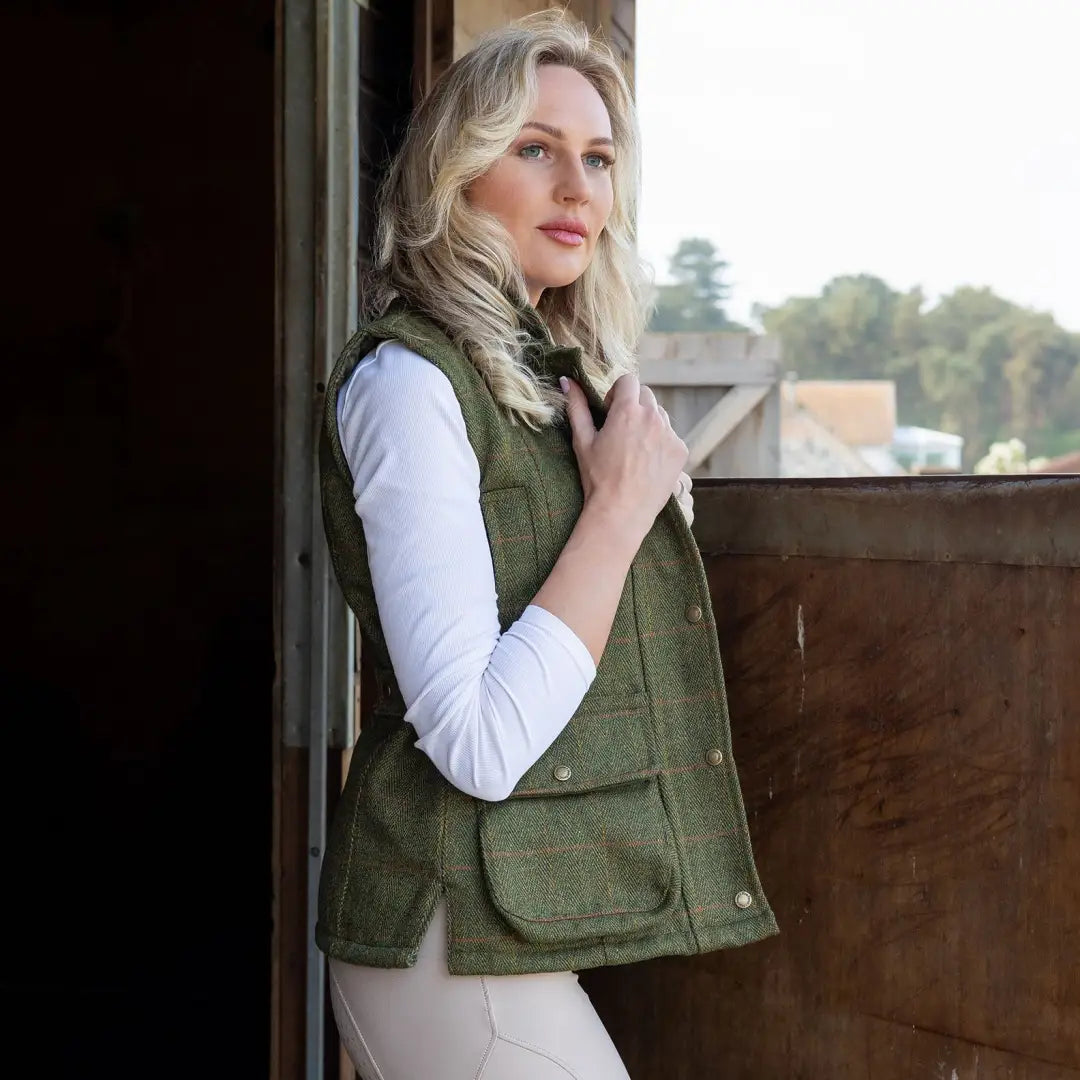 Green quilted vest over white top, perfect for style with the New Forest Ladies Tweed Gilet