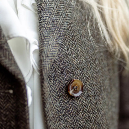 Tweed jacket with a brown button, part of the Forest Lizzie Tweed Coat collection