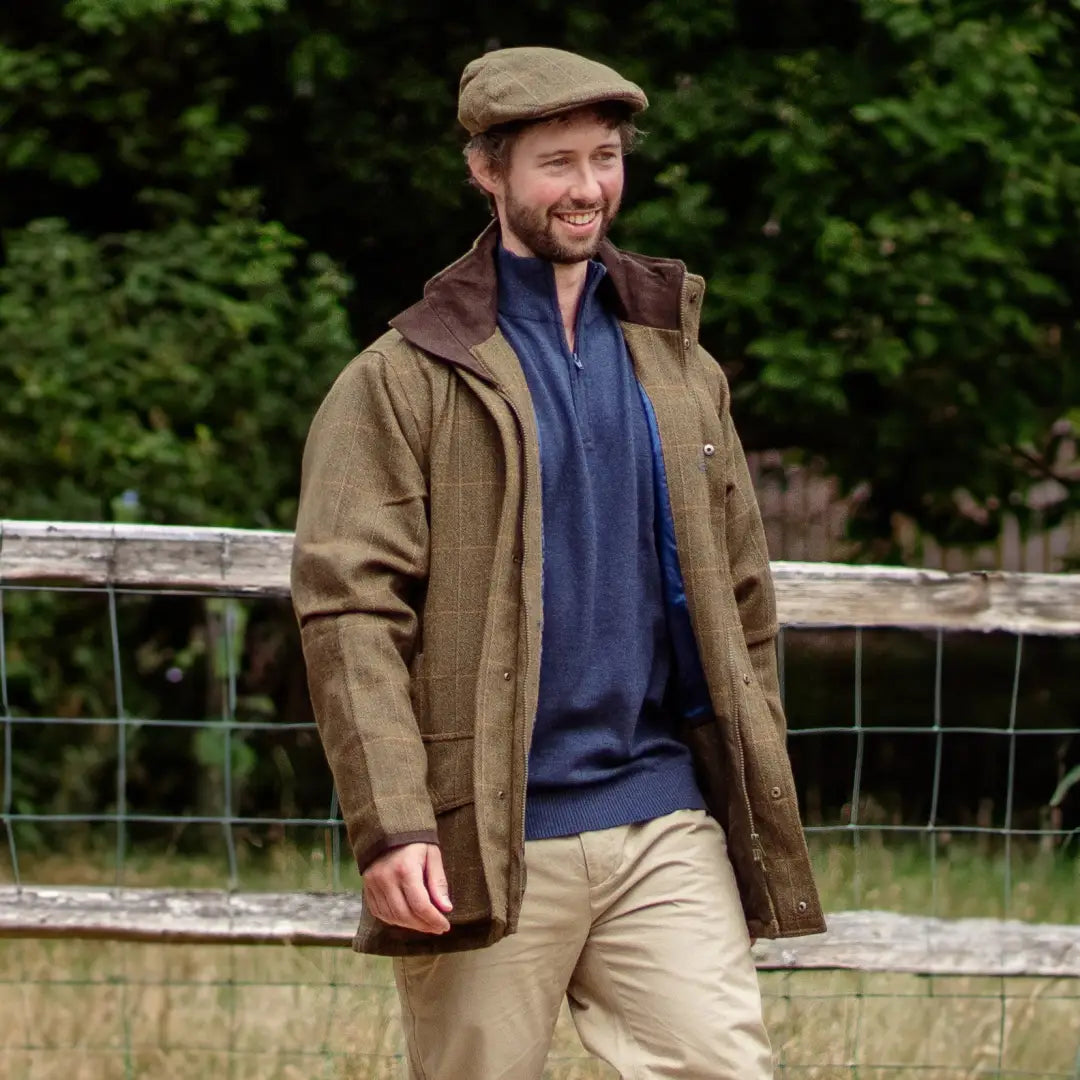 Smiling man rocking a tweed flat cap and casual country style in New Forest