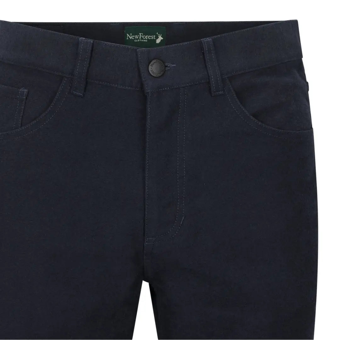 Dark blue Forest Moleskin Jeans featuring visible pockets and button closure