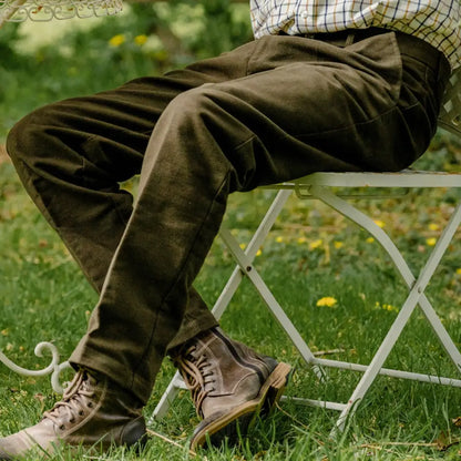 Brown leather boots on a person in grass, perfect with Forest Moleskin Trousers