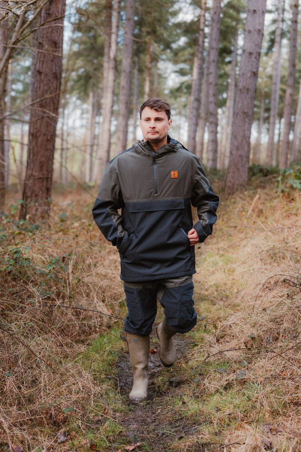 Man in outdoor gear rocking Forest Nightjar Trousers for a stylish adventure