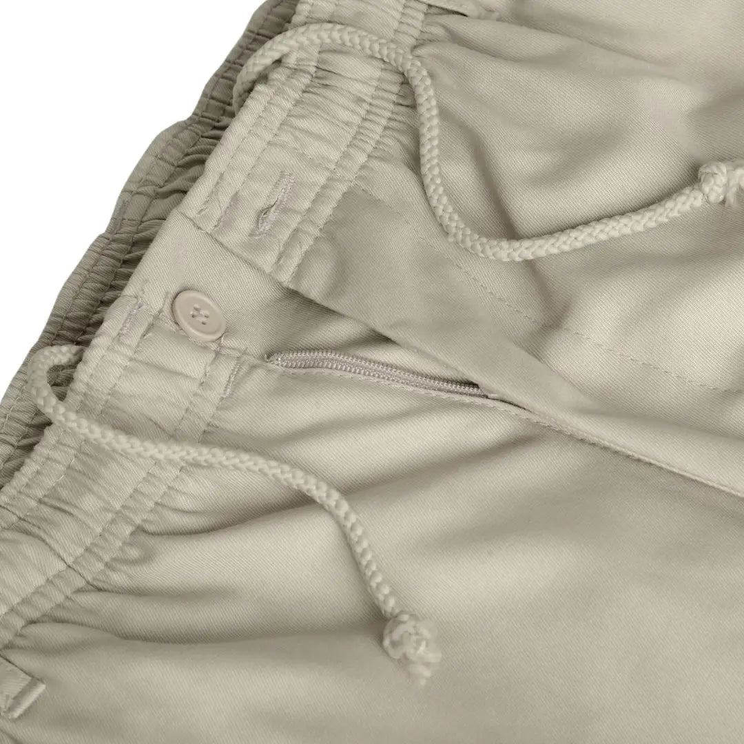 Beige drawstring waistband of New Forest size rugby trousers with zipper pocket