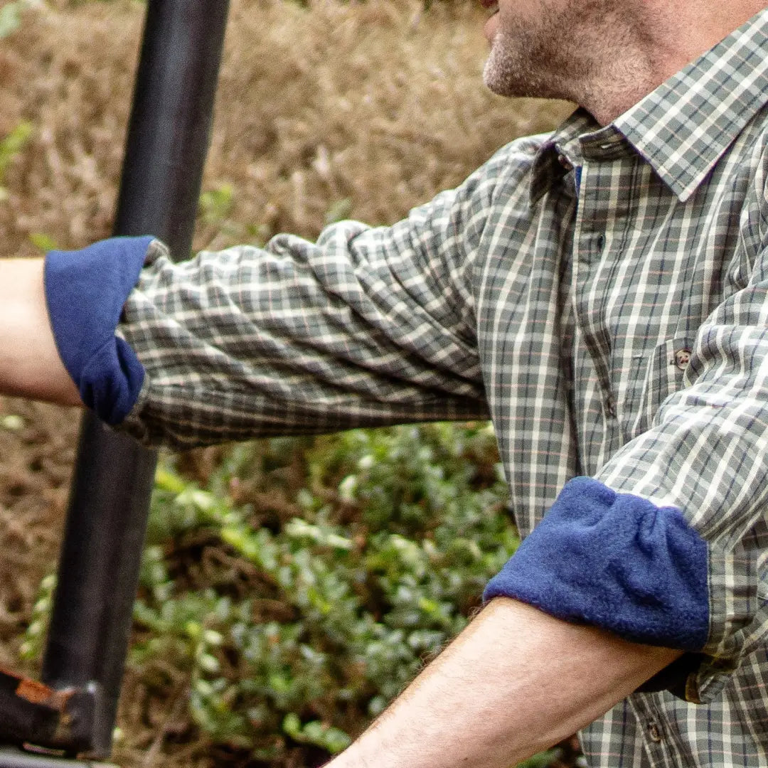 Plaid button-up shirt with rolled sleeves and blue cuffs, a stylish premium fleece lined shirt