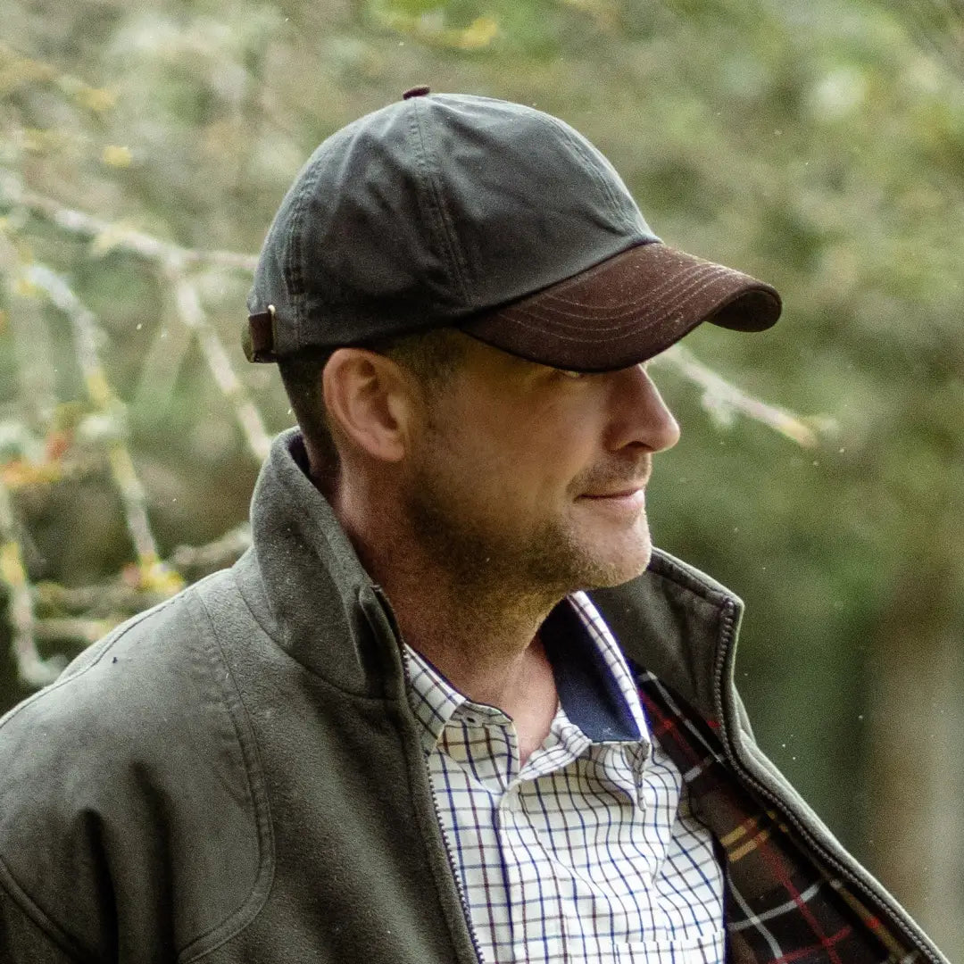 Man rocking a New Forest Wax Baseball Cap in an outdoor setting. Perfect for adventures!