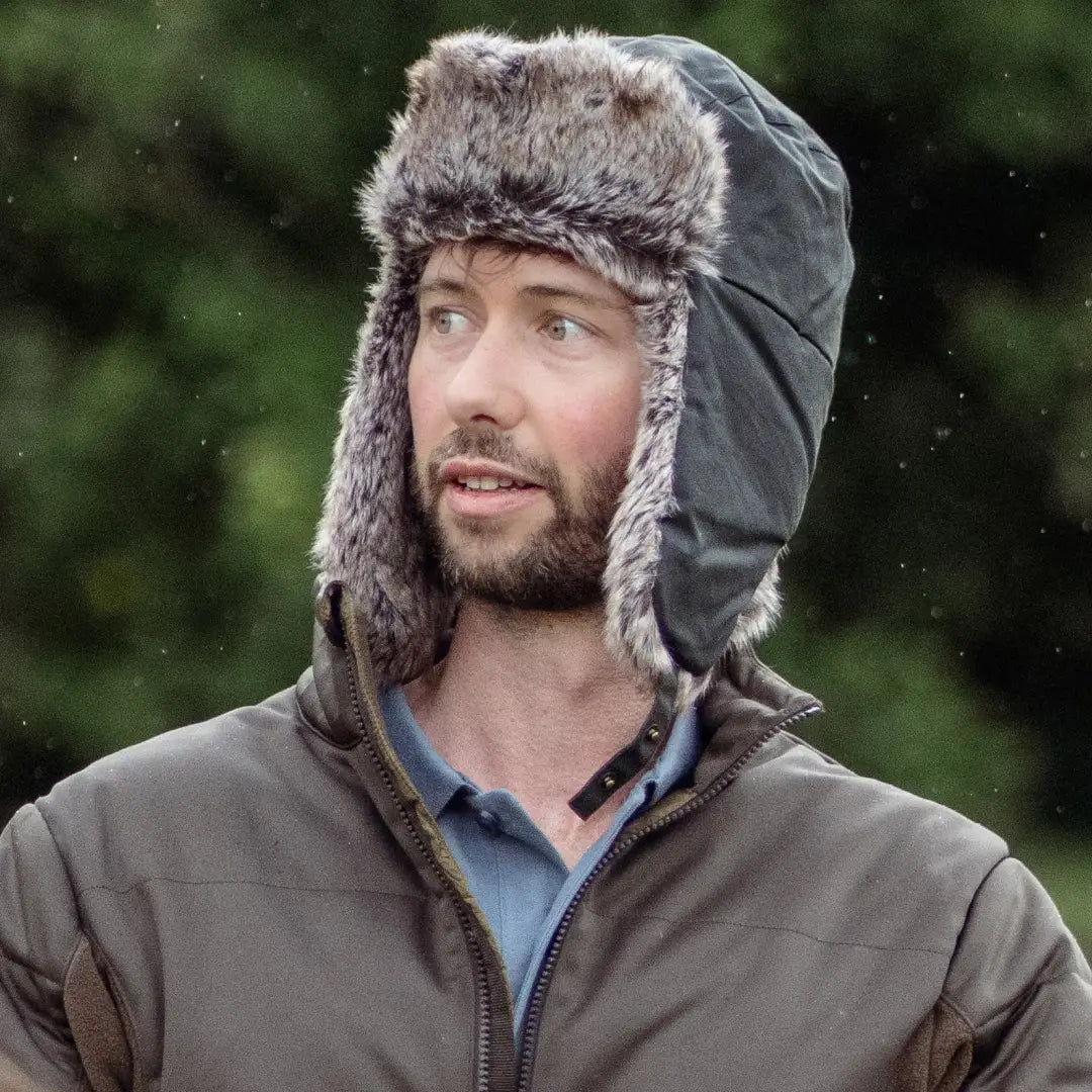 Bearded guy rocking a stylish Forest Wax Trapper Hat with ear flaps