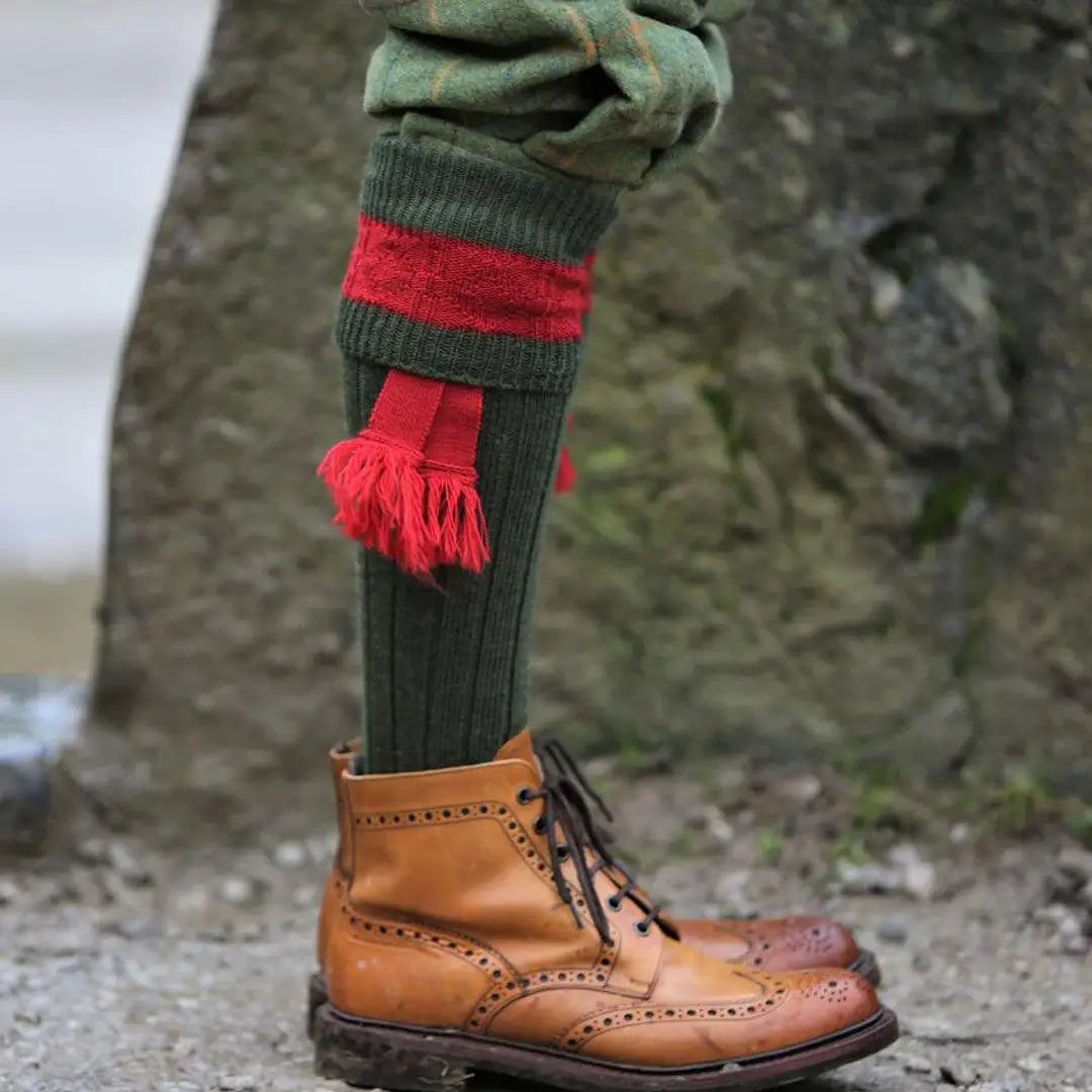 Tan leather brogue boot paired with Pennine Byron Shooting Socks, showcasing style and comfort