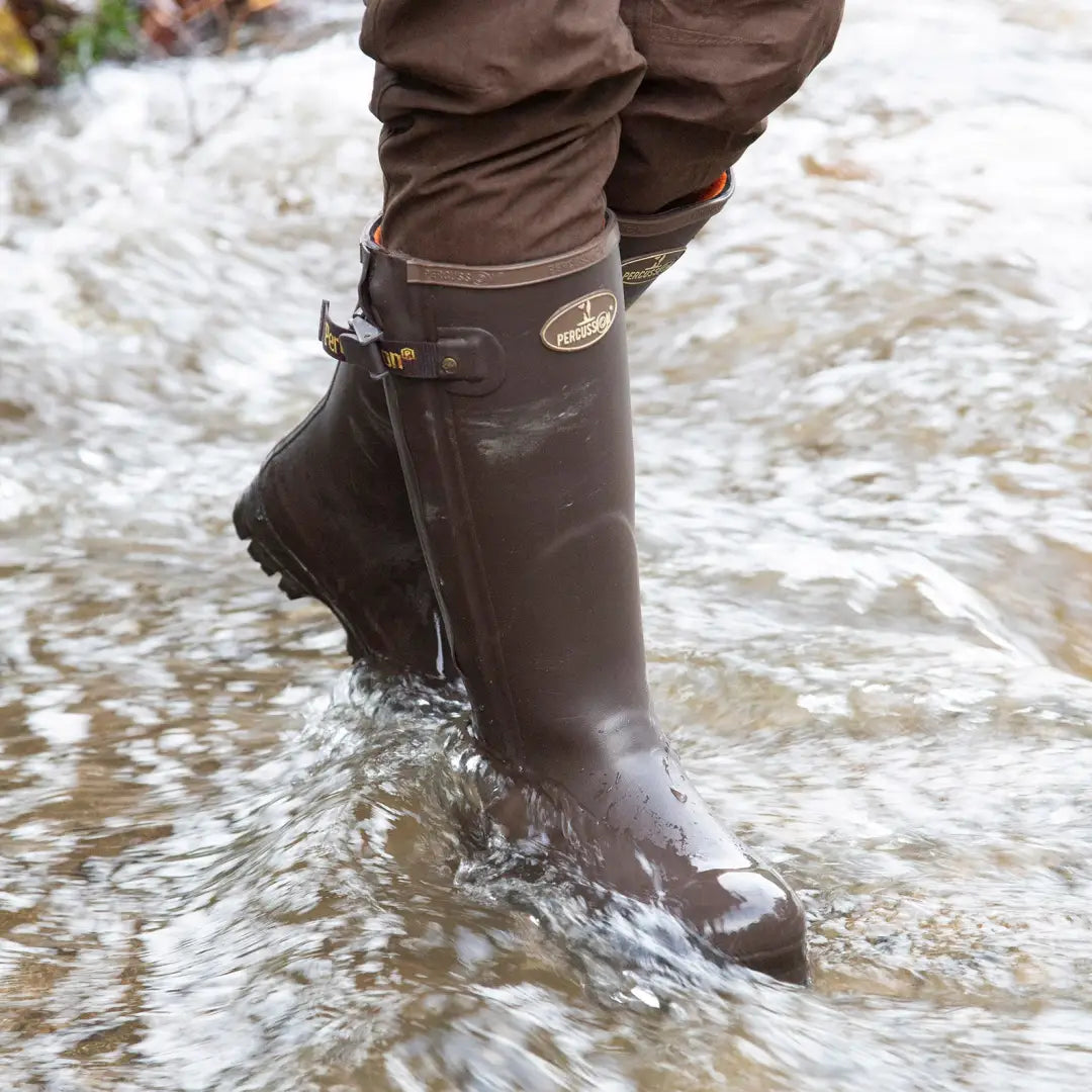 Brown Percussion Rambouillet zip boots splashing through shallow water for wet weather fun