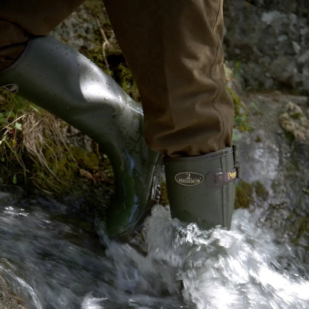 Green Percussion Sologne Neoprene Wellington Boots in flowing water for outdoor adventures