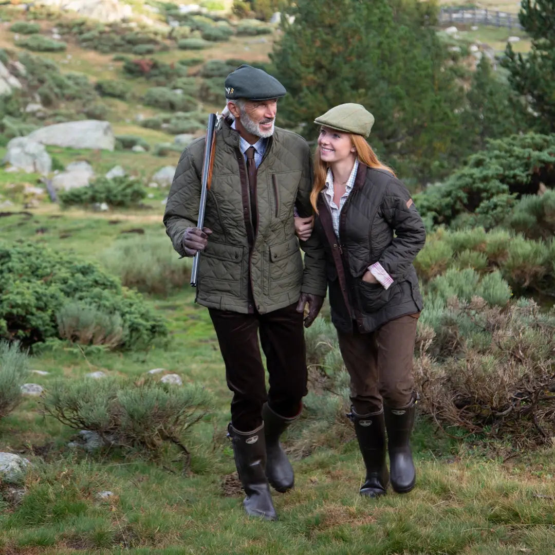 Couple in traditional attire enjoying the outdoors in a Percussion Stallion Quilted Jacket