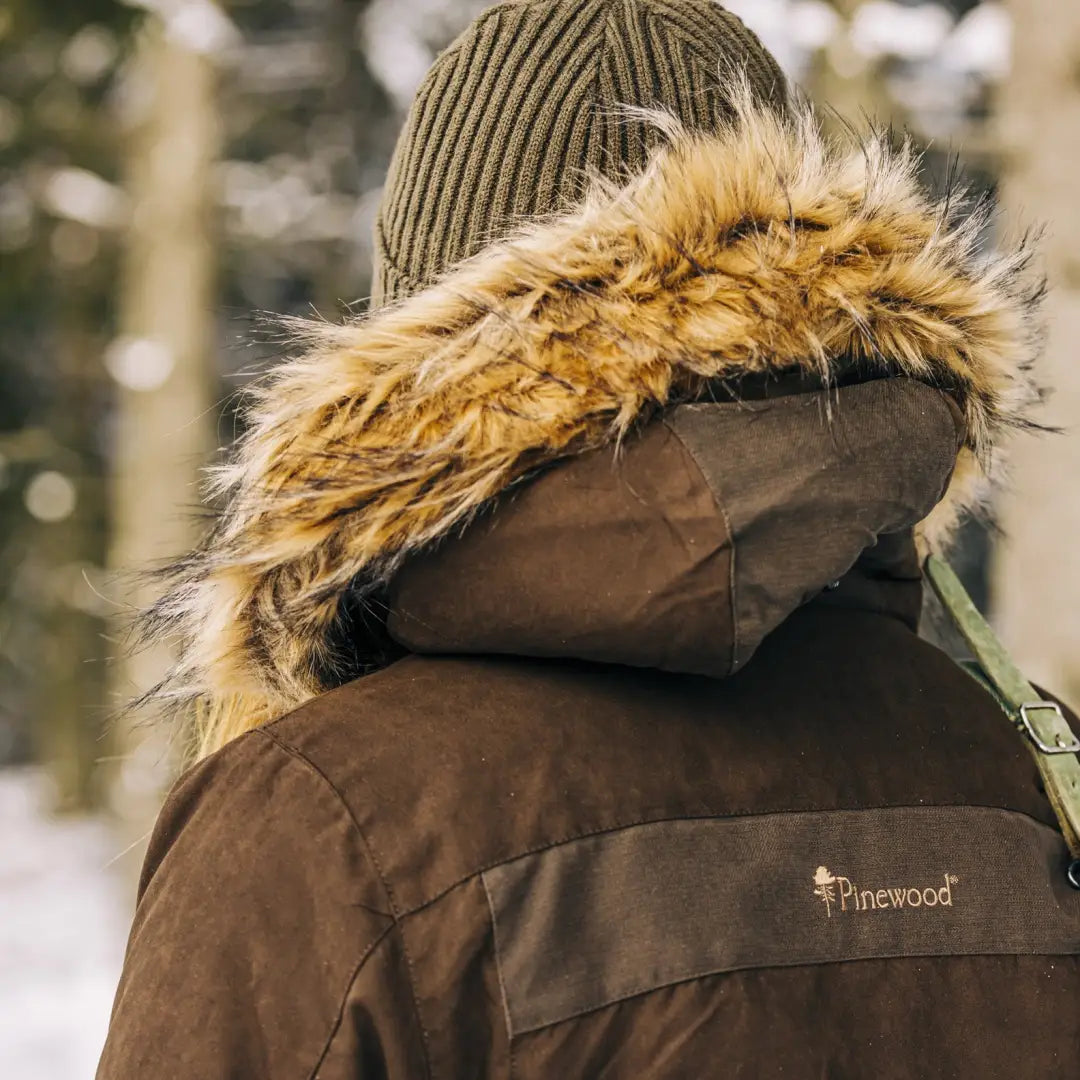 Winter coat with a fur-trimmed hood and Pinewood branding, perfect ladies hunting jacket