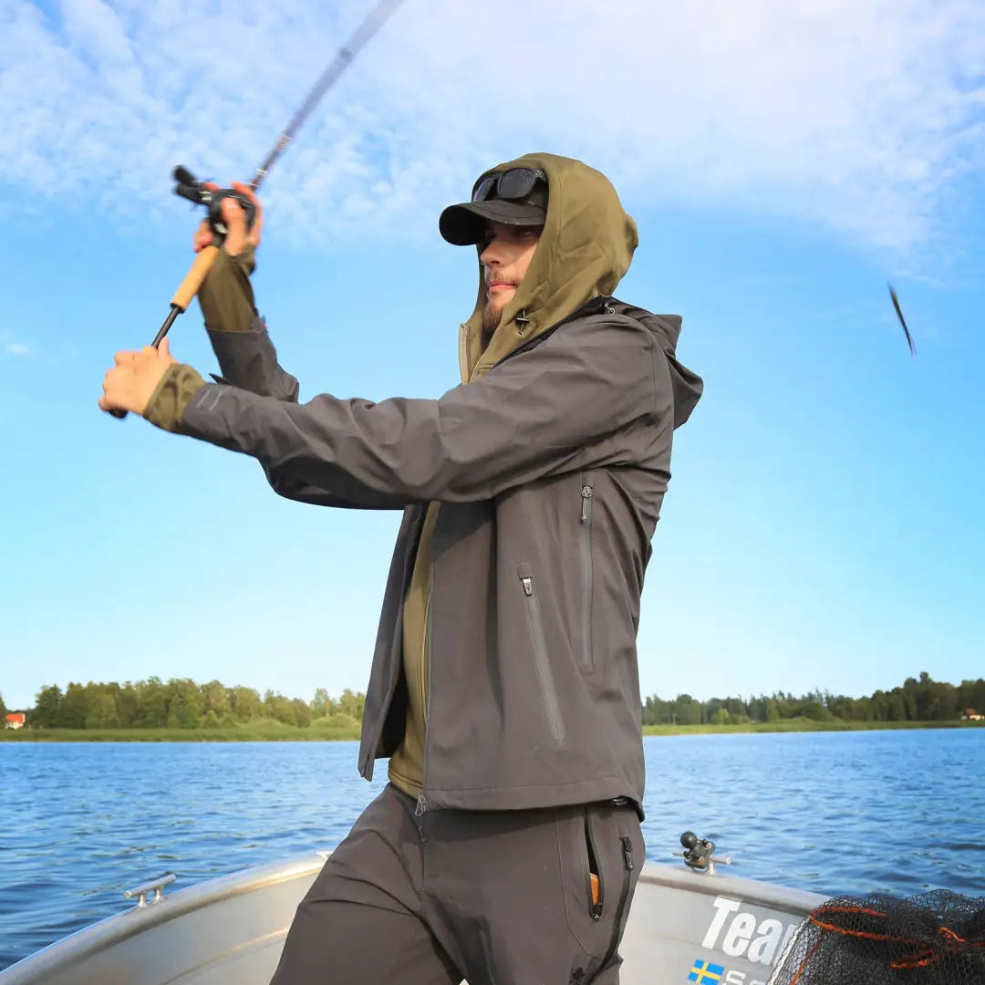 Person fishing from a boat in Pinewood Abisko Telluz Jacket anthracite outdoors