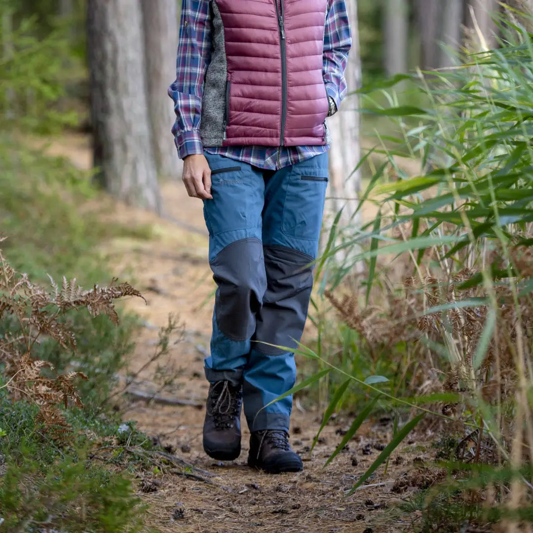 Person in Pinewood Ladies Caribou TC Trousers on a scenic forest trail