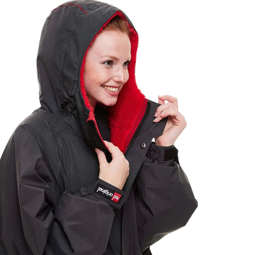 Black winter coat with red inner lining, perfect for the Red Pro Change Long Sleeve Evo Jacket