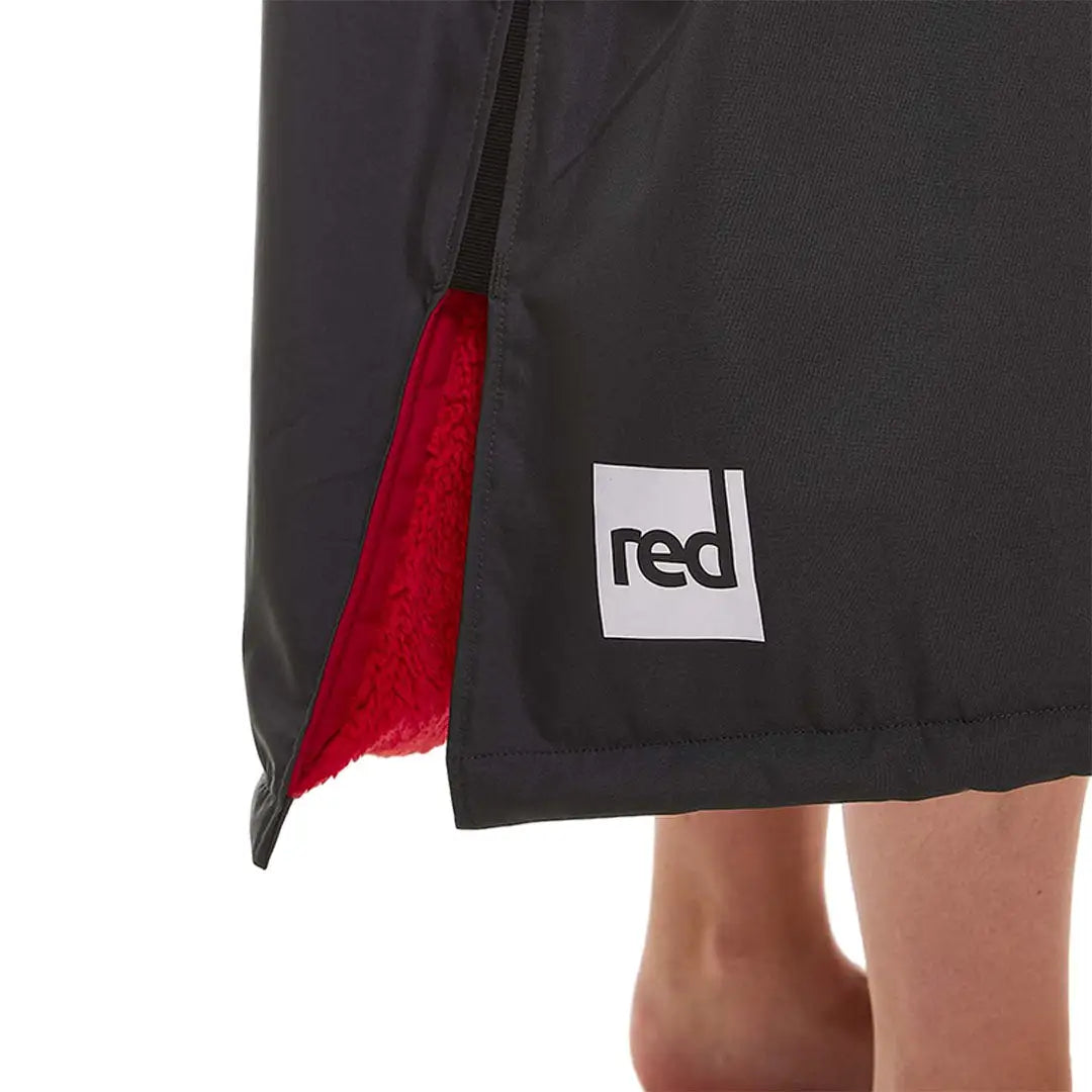 Black shorts with red accents and logo, perfect for wearing with the Red Pro Change jacket