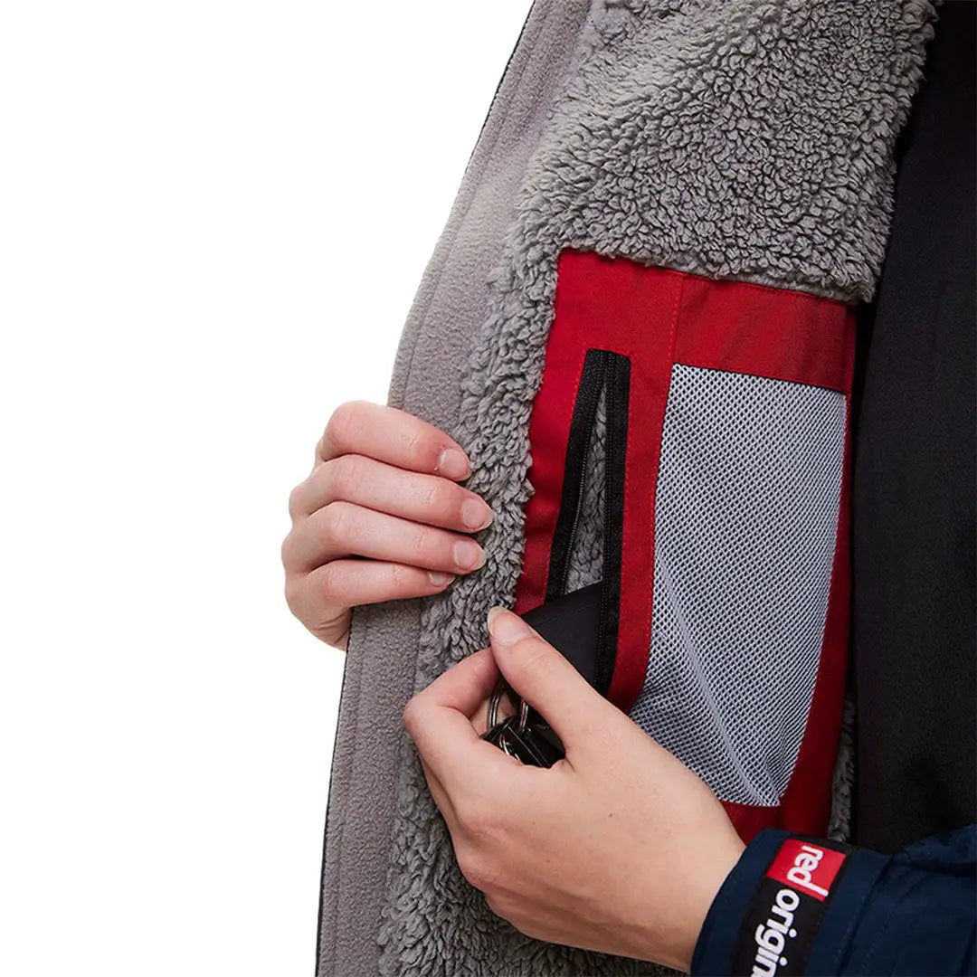 Fleece jacket with a red and gray inner pocket, perfect for your change robe needs