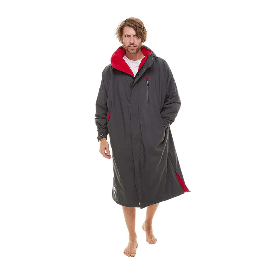 Long gray and red changing robe worn by a person in the Red Pro Change Long Sleeve Evo Jacket