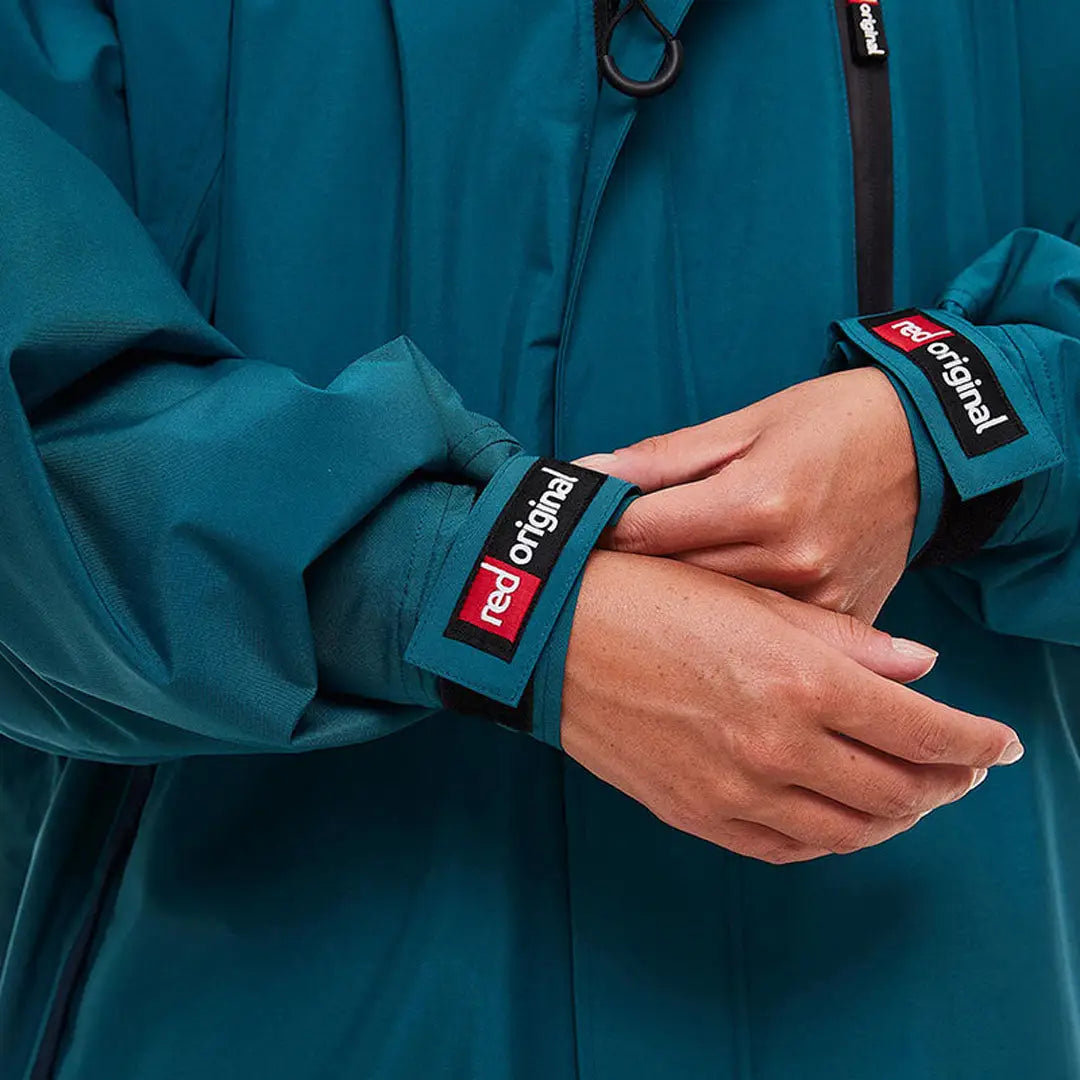 Teal Red Pro Change Long Sleeve Evo Jacket with red-labeled cuffs for stylish comfort