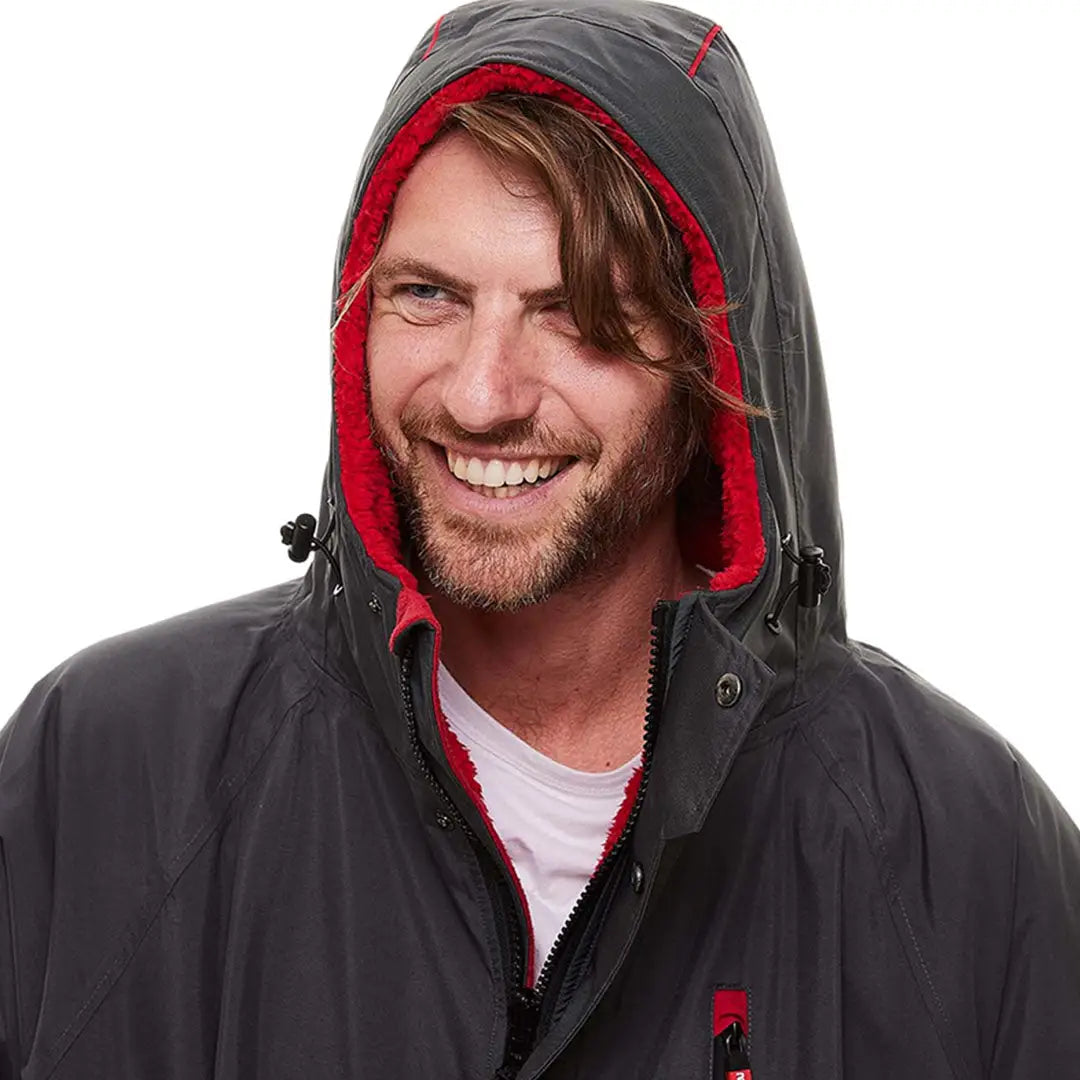 Smiling bearded man in Red Pro Change Long Sleeve Evo Jacket, perfect change robe for adventures