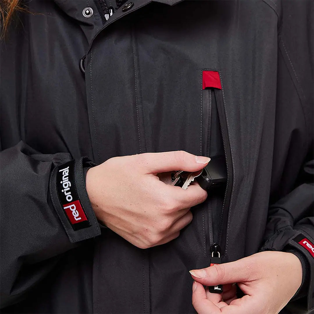 Black Pro Change Long Sleeve Evo Jacket with red accents and zippered pockets