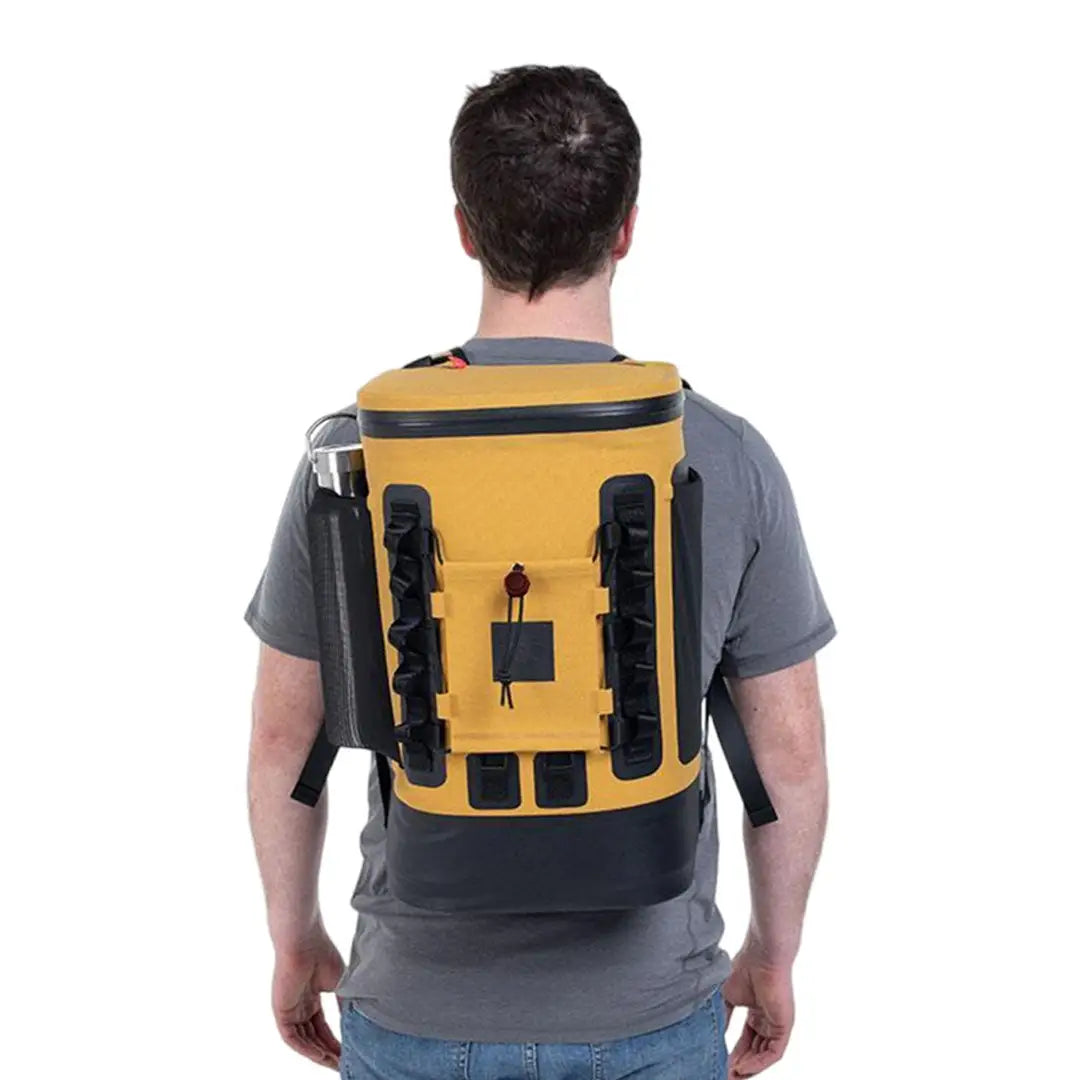 Person wearing a yellow and black cool bag backpack, perfect for outdoor adventures