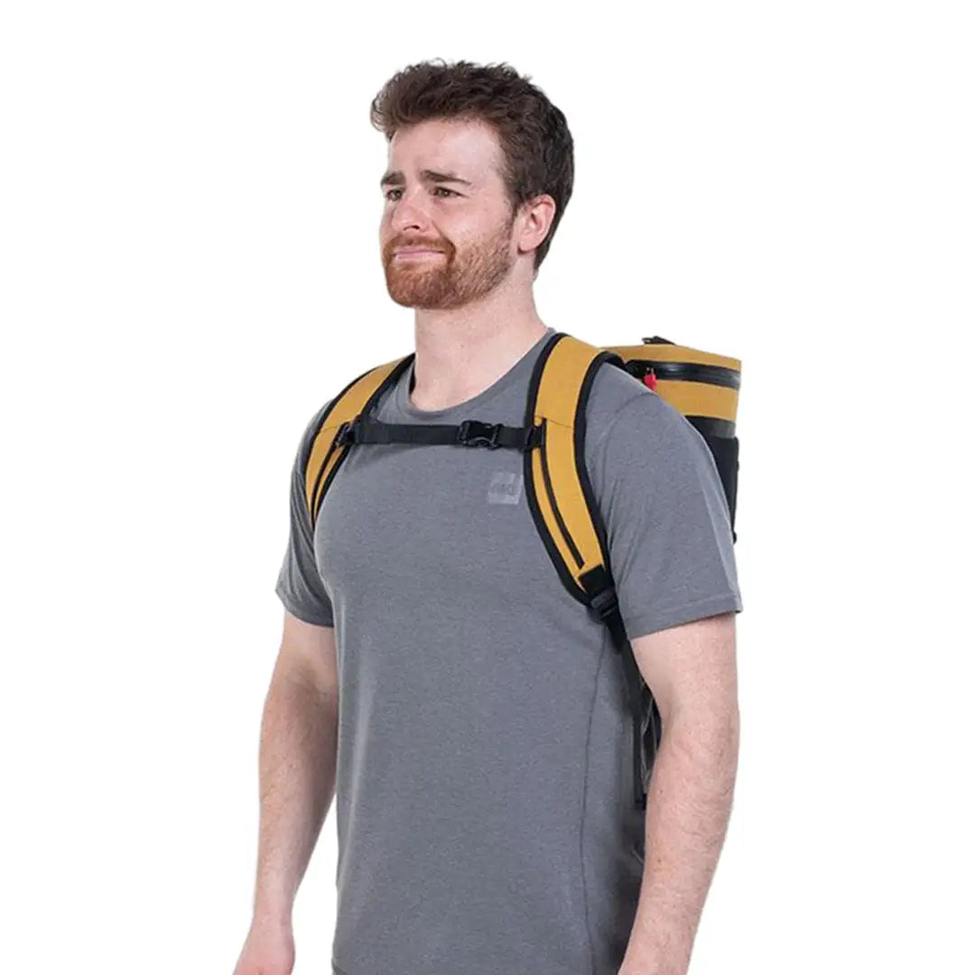 Man in gray t-shirt and yellow backpack using the Red Waterproof Cool Bag Backpack