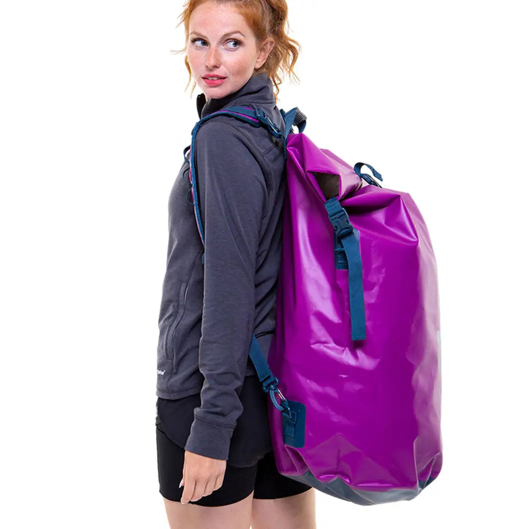 Bright purple waterproof dry bag backpack with blue straps for outdoors and hunting gear