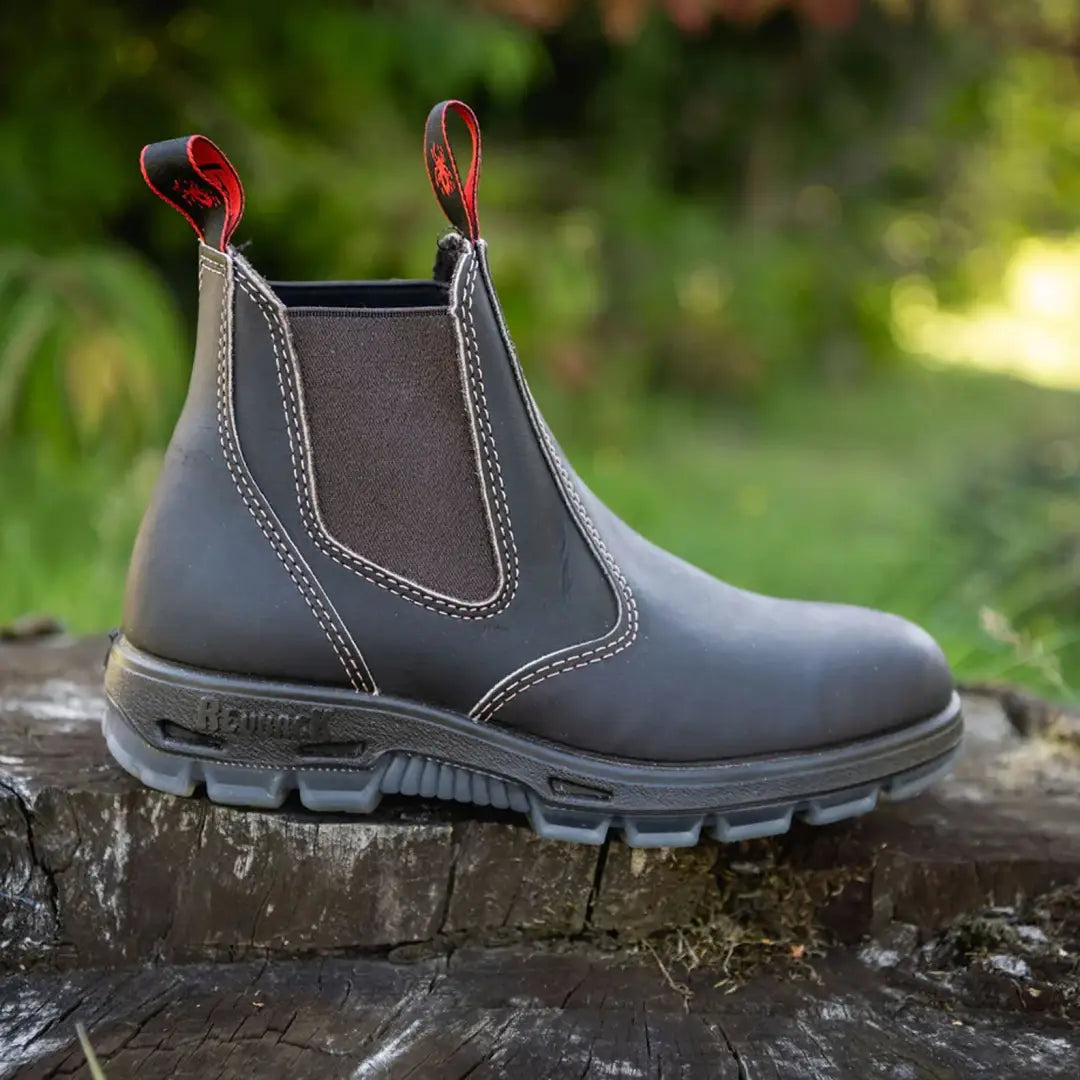 Gray Redback Boot with red pull tabs and rugged sole, perfect for any adventure