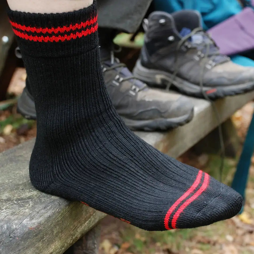 Black sock with red stripes on foot, perfect for Redback Boot Socks - Twin Pack