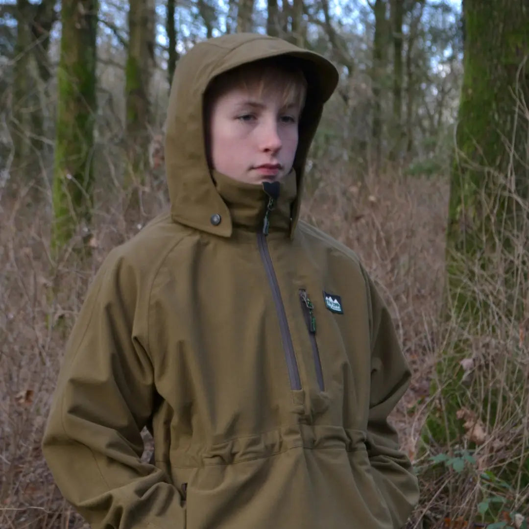 Tan hooded jacket in woods worn by a kid in a Ridgeline Kids Monsoon Classic Smock