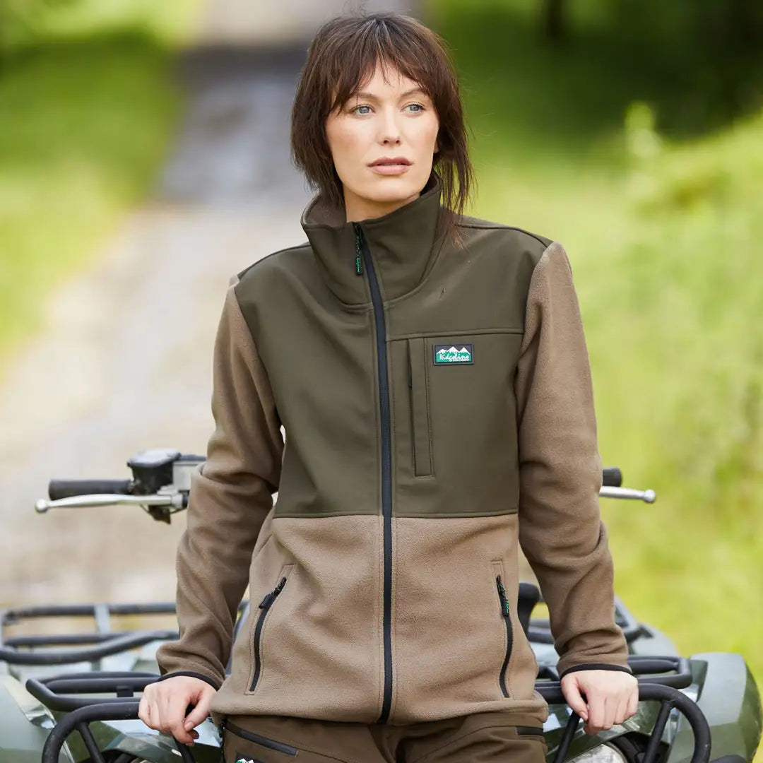 Woman in a two-tone fleece hybrid jacket, perfect for country clothing and hunting adventures