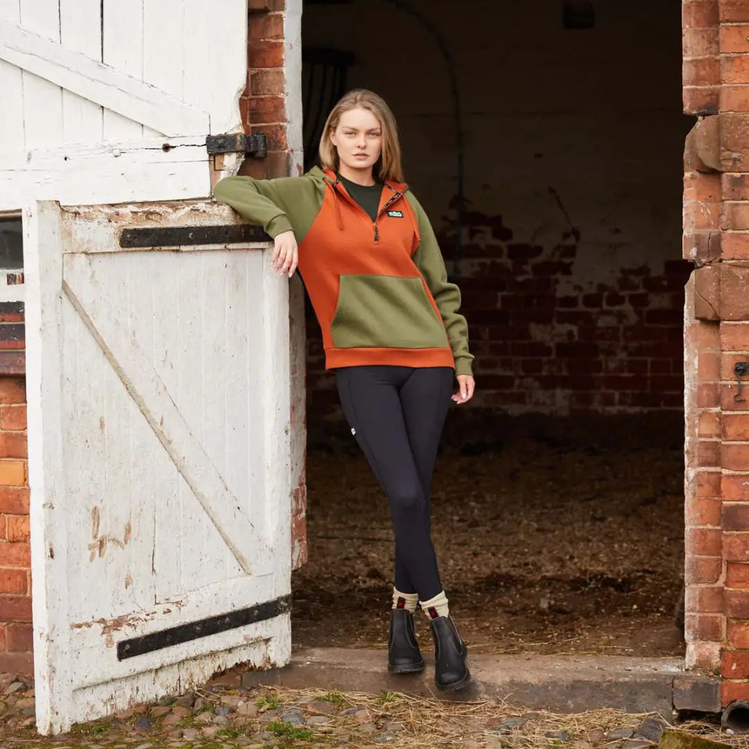 Two-tone orange and olive green fleece pullover paired with Ridgeline Ladies Infinity Leggings