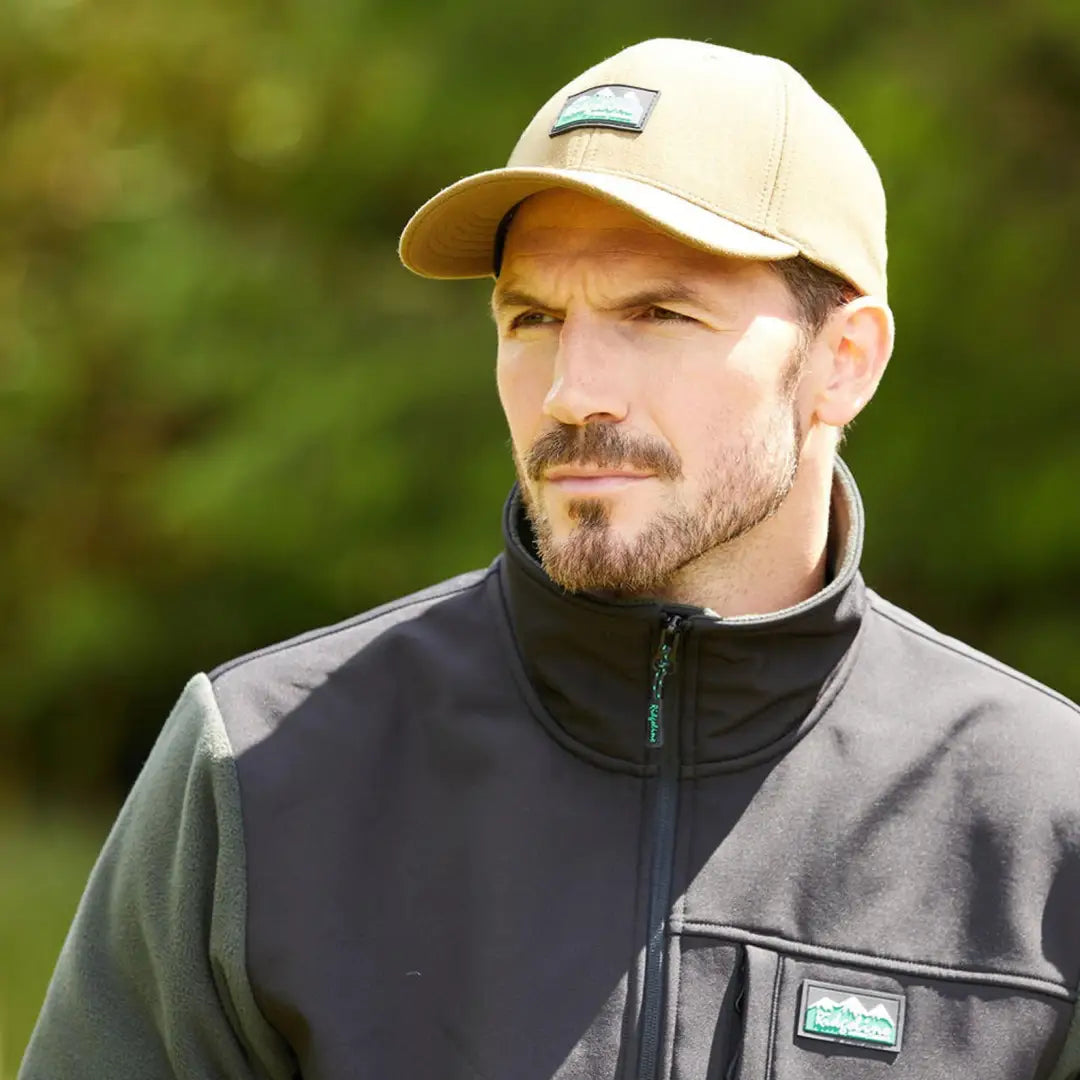 Man in a baseball cap and dark jacket showcasing the Monsoon Classic Cap