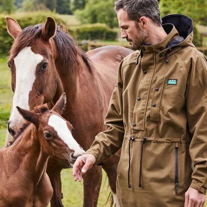 Brown horse with white blaze and foal beside a Ridgeline Monsoon Classic Smock