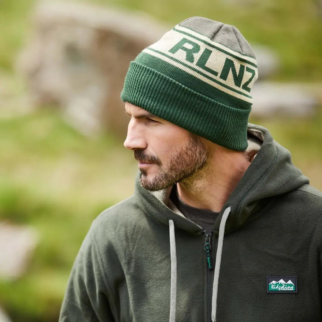 Green and white RLNZ knitted beanie showcasing stylish RLN text for casual wear