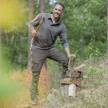 Middle-aged man in Rovince Flexline Trousers showing off a stylish hiking pose