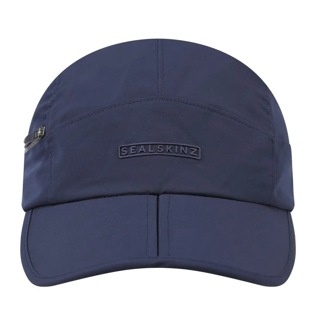 Navy blue Sealskinz cap with foldable ear flaps and buckle clip closure for warmth