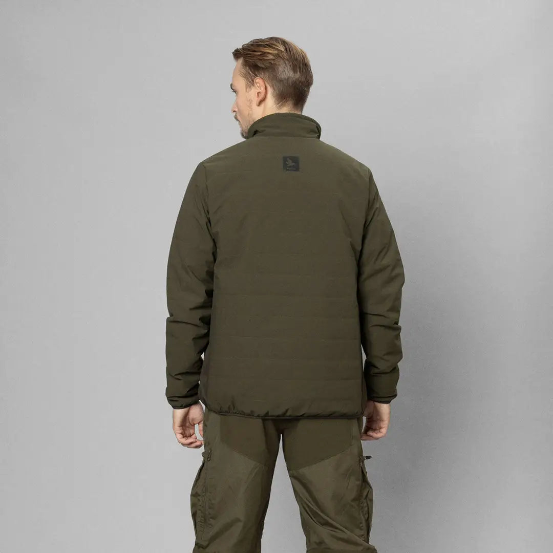 Green military-style jacket from behind showcasing Seeland Celsius Heat Jacket