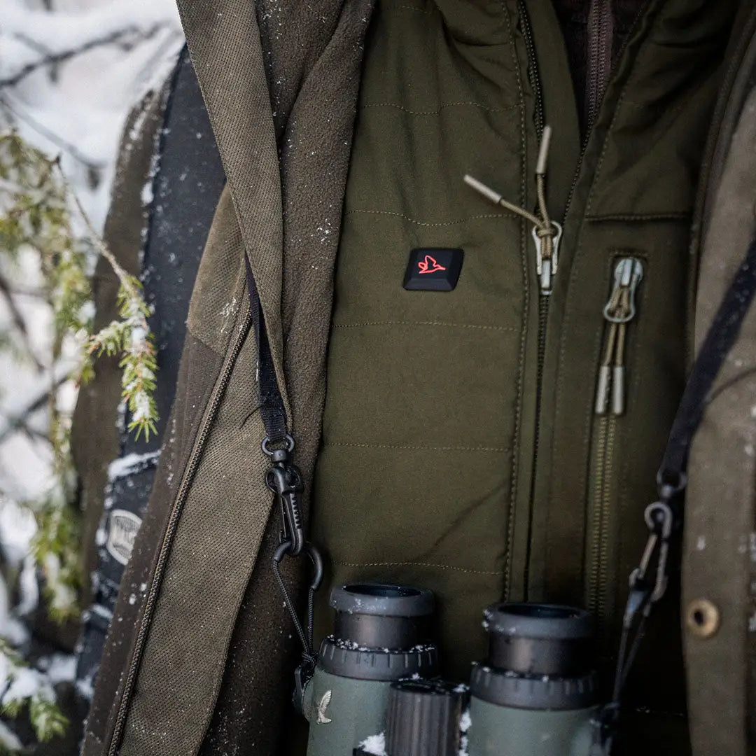 Olive green Celsius Heat Waistcoat with zippered pockets and logo patch