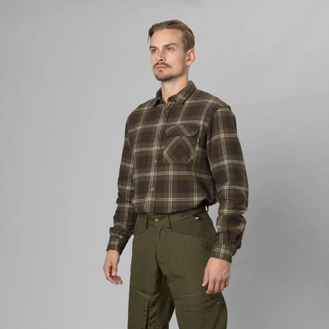 Man rocking a Seeland Glen Flannel Shirt paired with olive green pants