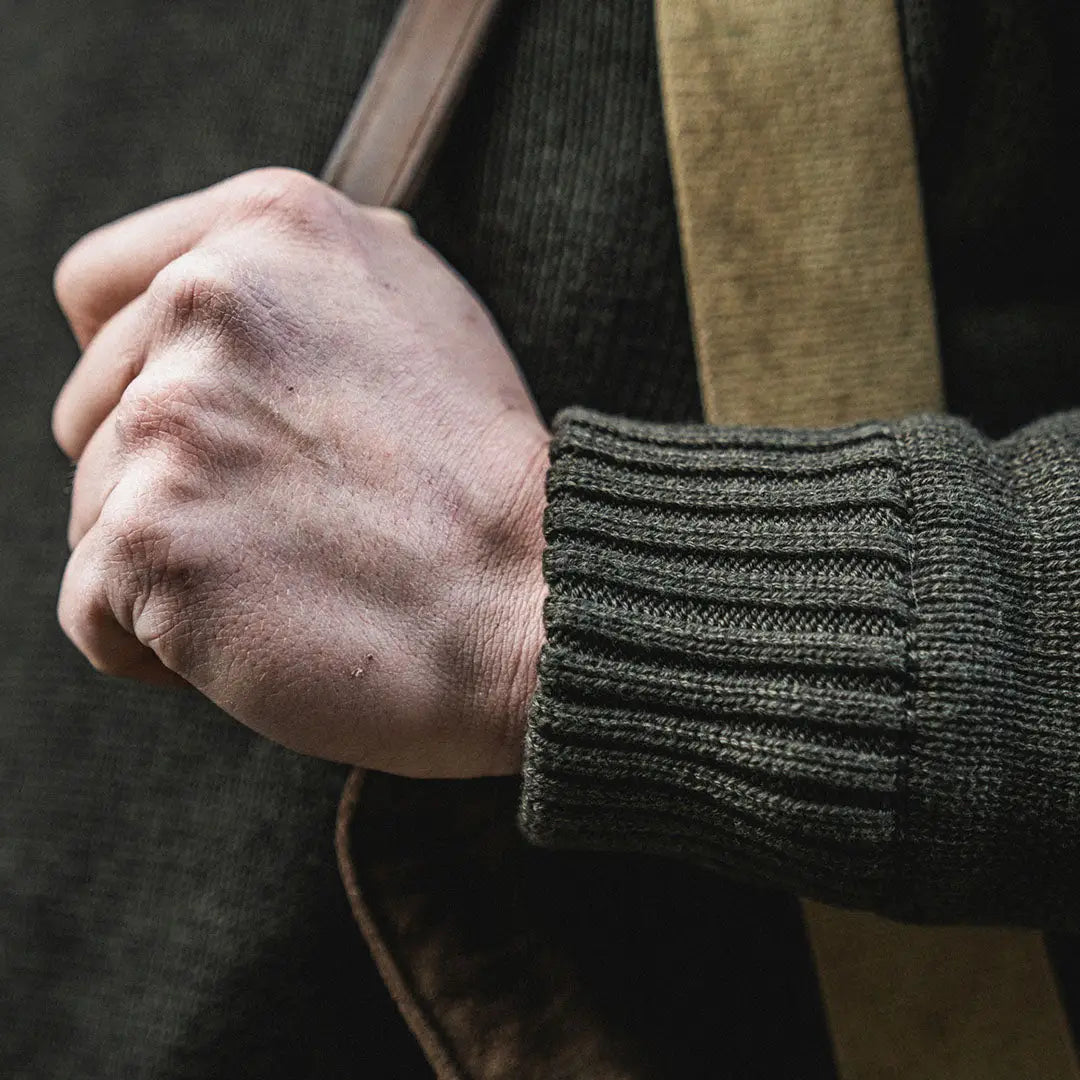 Clenched fist in a knitted sleeve, showing off the Seeland Haze Windbreaker for outdoors lovers