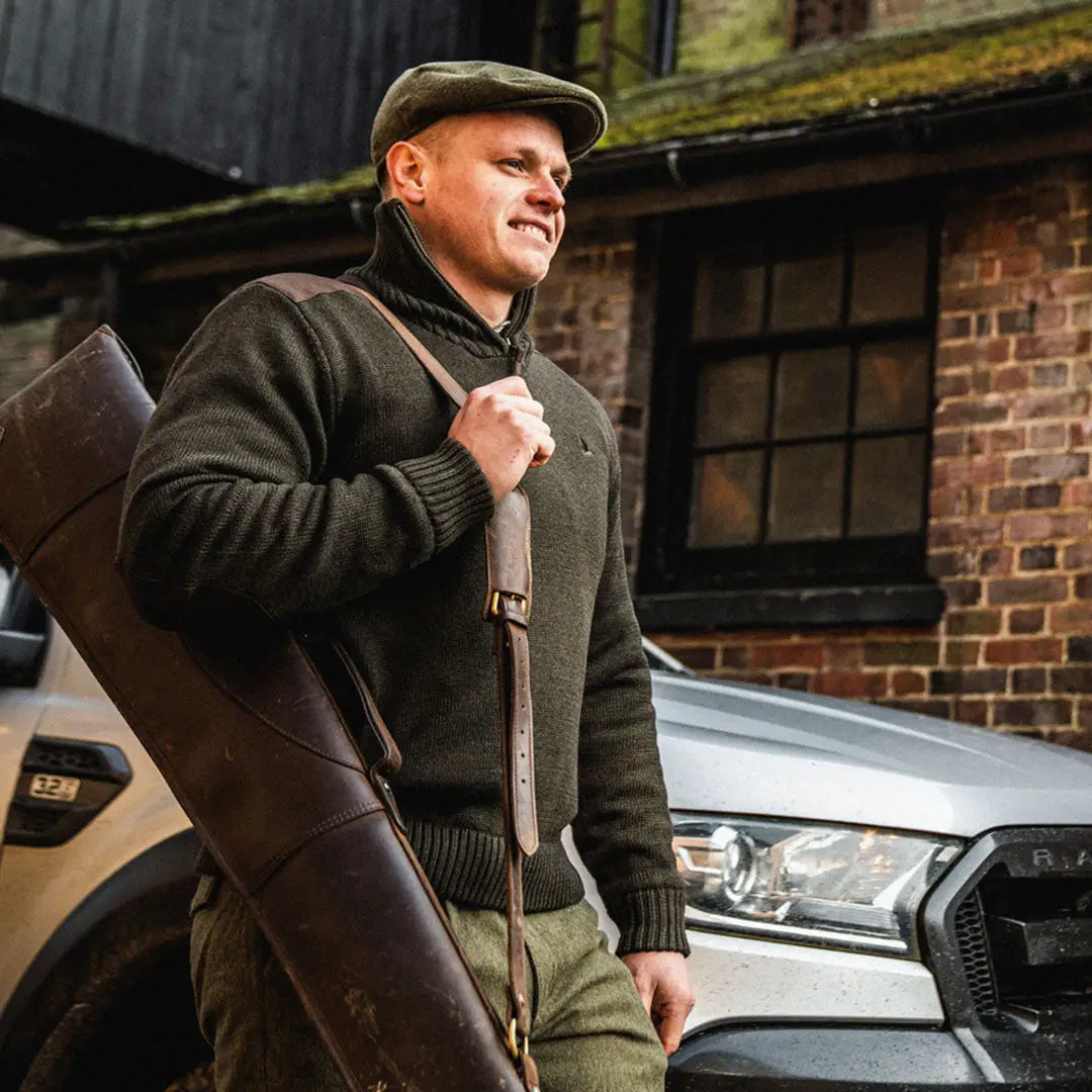 Man in flat cap and sweater by a car, showcasing Seeland Haze Windbreaker for outdoors