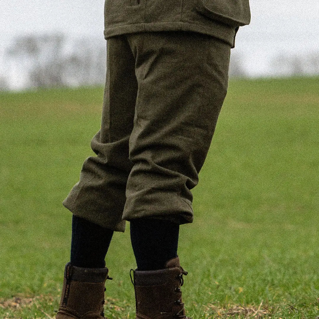 Pair of legs in Seeland Hillside Breeks with socks and boots on grass, featuring PFAS-free Seetex® membrane