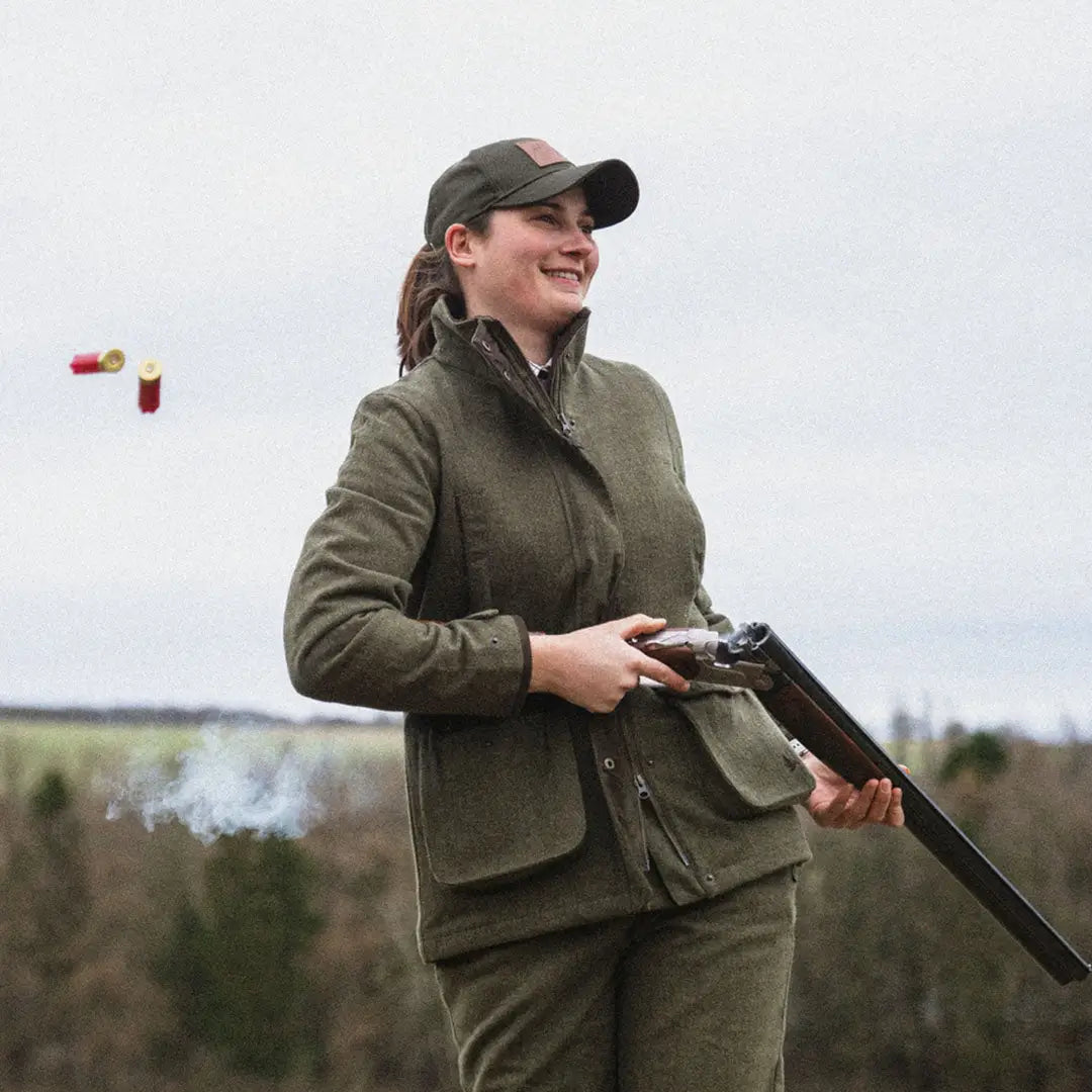 Woman in hunting gear with a shotgun wearing Seeland Hillside Harriet Jacket